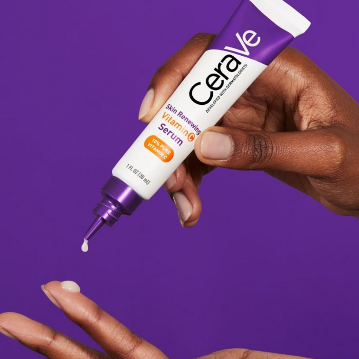 Lumina Pharmacy CeraVe Skin Renewing Vitamin C Serum being applied to a fingertip from a white and purple tube